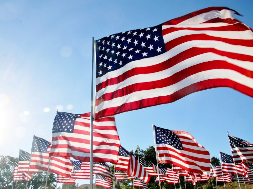 United States flags blow in the wind in Malibu, CA United States flags blow in the wind in Malibu, CA