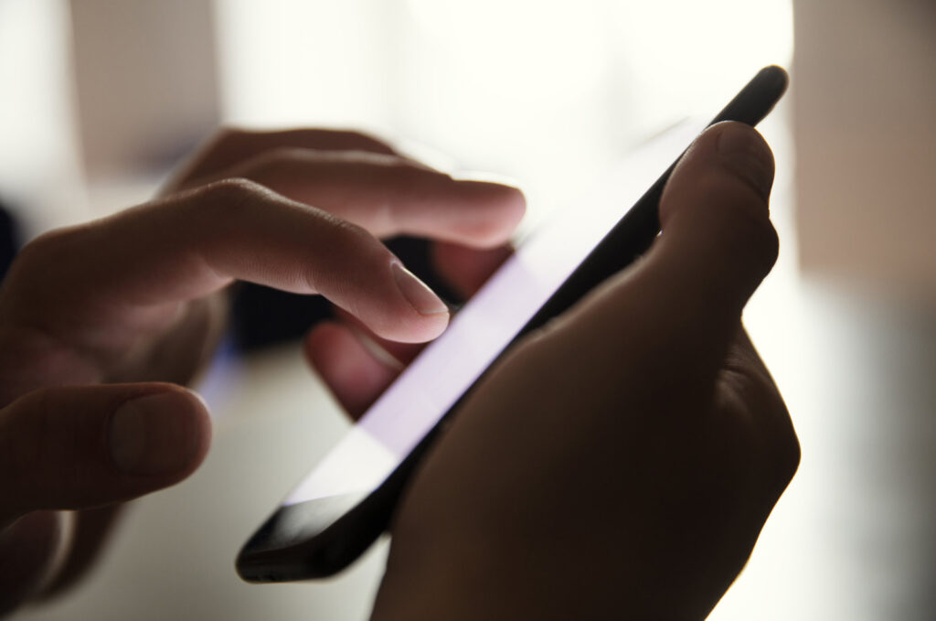 Texting on cellphone in dark Texting on cellphone