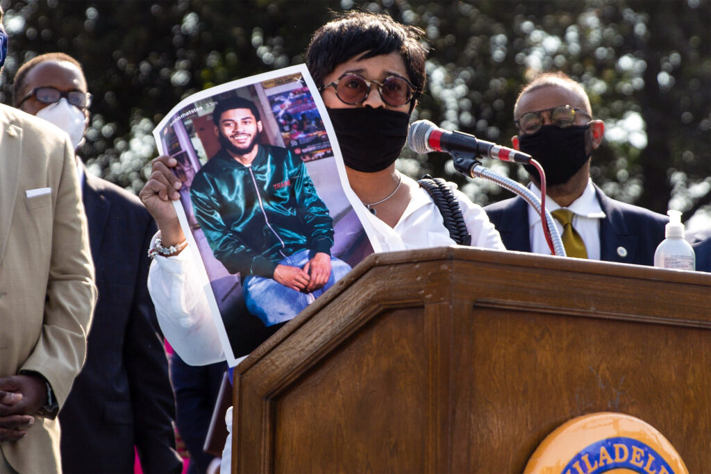 gunviolence-lawsuit-2020oct-01 Tamika Morales holds a photo of her son Ahmad, who was killed July 2020 in South Philadelphia. (Kimberly Paynter/WHYY)