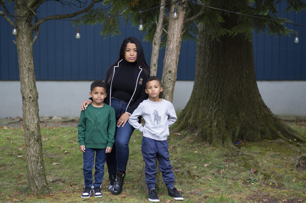 Farida Mercedes and her two sons Sebastian, 5, (left) and Lucas, 7, stand in their backyard in Fairlawn, N.J. Mercedes left her job as an assistant VP of HR at L'Oreal in August after working there for 17 years. As hundreds of thousands of women dropped out of the workforce in September, Latinas led the way, leaving at nearly three times the rate of white women.