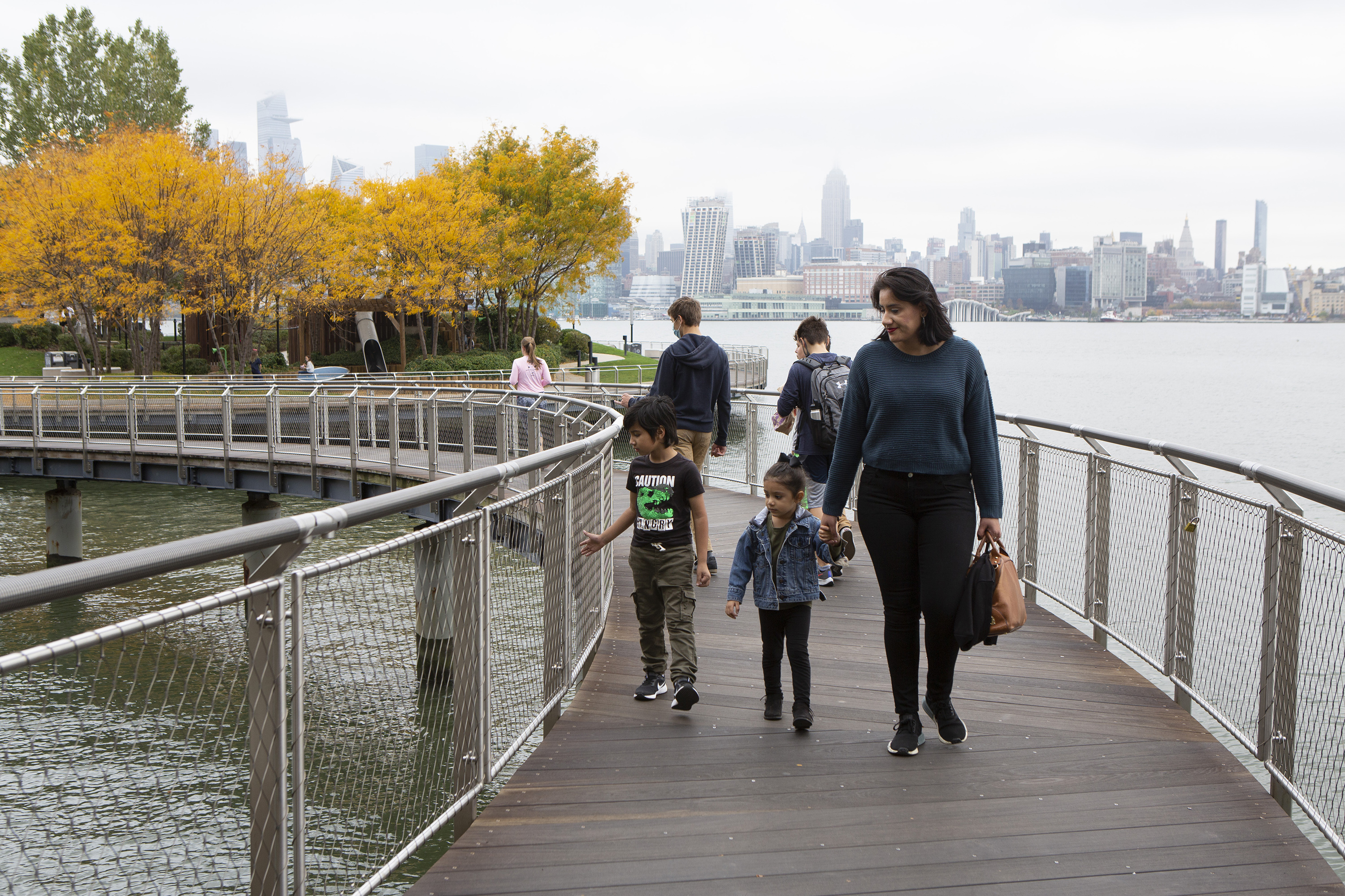 Sabrina Castillo walks with her children Lorenzo, 5, and Camila, 3