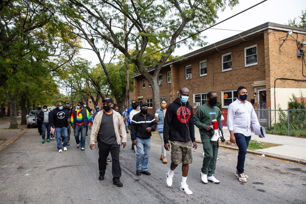 Members of the Richard Allen, Penn Town and Harrison housing communities hold a 'Put the Guns Down' peace walk through their neighborhood.