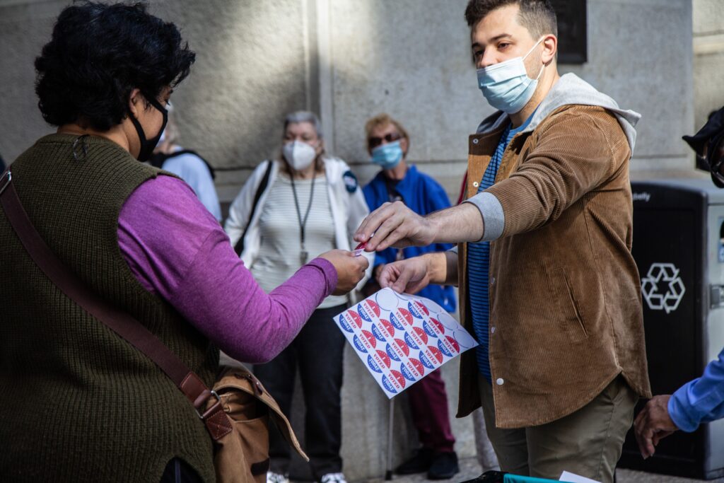 satellite_election_office_city_hall_KP_101520_05 Voters receive a sticker after voting at one of Philadelphia’s satellite election offices