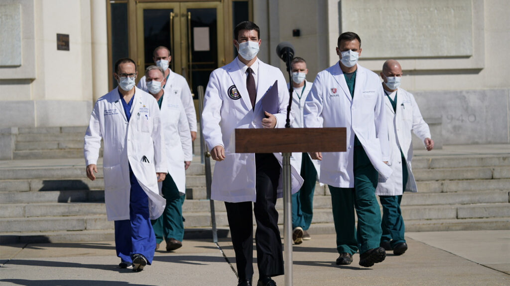 Sean Conley Dr. Sean Conley and other doctors walk out of Walter Reed National Military Medical to talk with reporters about President Trump's condition on Monday, Oct. 5. (Evan Vucci/AP Photo)