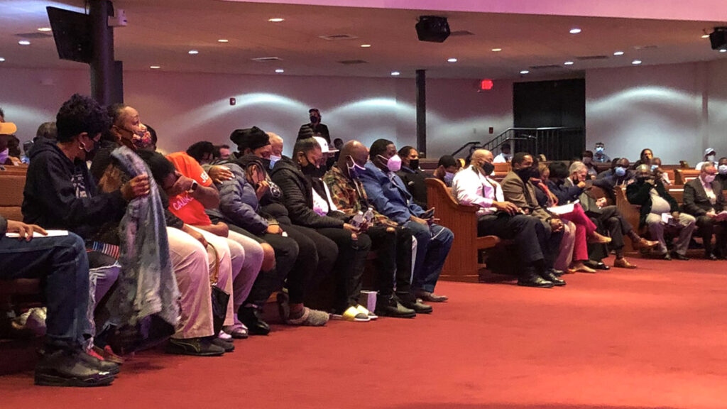 Family of the late Walter Wallace Jr. fill the front row of a community meeting inside a church, the day after he was shot to death by police. (Michaela Winberg/Billy Penn)