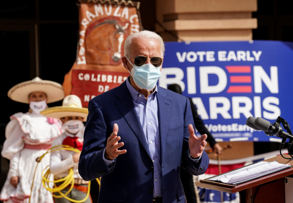 Members of a mariachi band look on as Joe Biden discusses the disproportionate ways coronavirus has impacted Latinos in Nevada during a campaign stop at the East Las Vegas Community Center in Las Vegas on Oct. 9. Members of a mariachi band look on as Joe Biden discusses the disproportionate ways coronavirus has impacted Latinos in Nevada during a campaign stop at the East Las Vegas Community Center in Las Vegas on Oct. 9.