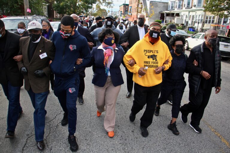 Community leaders and members of the clergy led a march Tuesday from the site where Walter Wallace Jr. was killed to the police precinct at 55th and Pine (Emma Lee/WHYY)