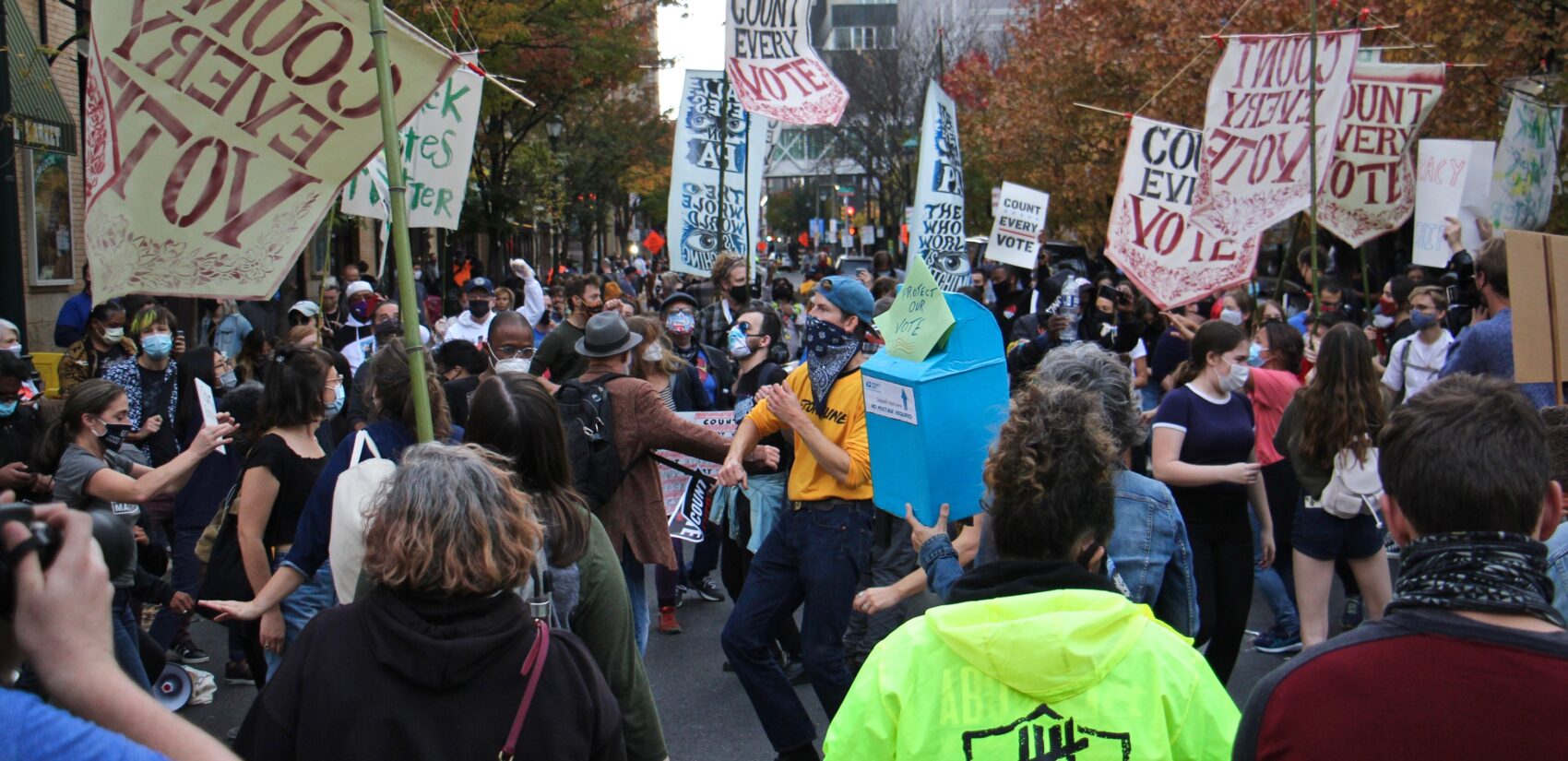 Protesters dance in the street outside the Pennsylvania Convention Center, where Philadelphia's mail and absentee ballots are being counted