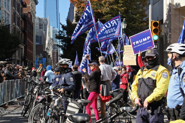 Philadelphia police create a buffer between dueling rallies outside the Pennsylvania Convention Center. (Emma Lee/WHYY)