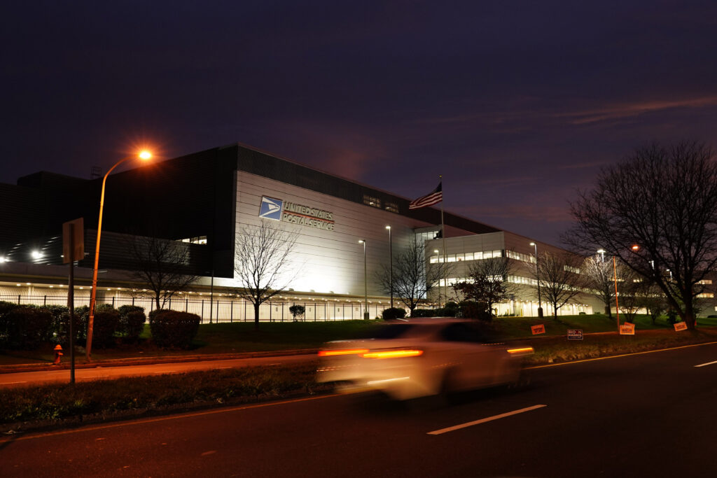 Election 2020 Pennsylvania Voting A car drives past a United States Postal Service facility, Tuesday, Nov. 3, 2020, in Philadelphia. (AP Photo/Matt Slocum)