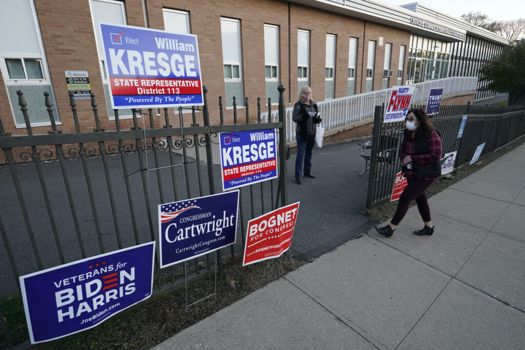 Election 2020 Pennsylvania Voting A voter arrives to cast her ballot at the Charles Sumner Elementary School on Election Day, Tuesday, Nov. 3, 2020, in Scranton, Pa. (AP Photo/Mary Altaffer)