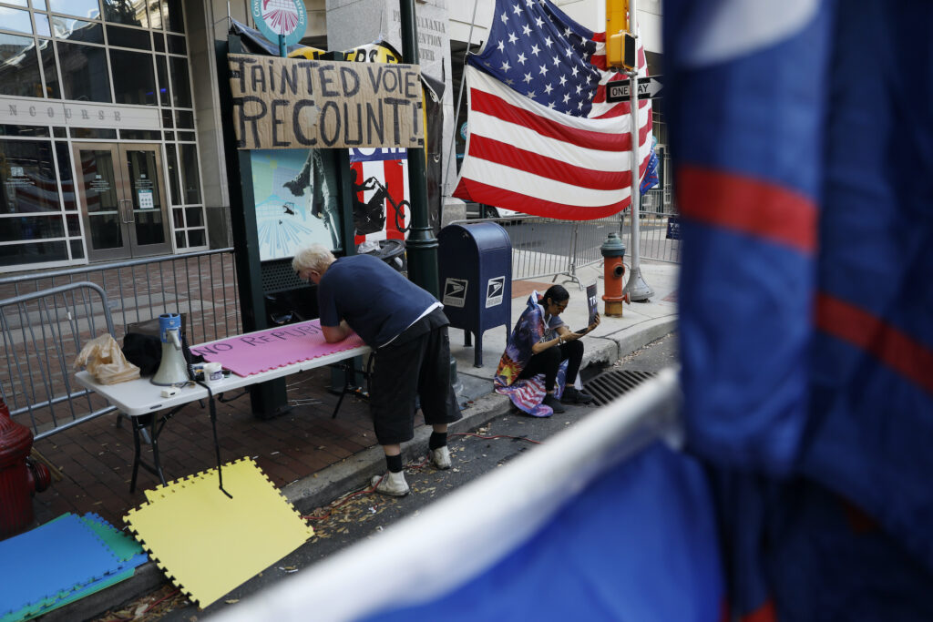 Election 2020 Protests Philadelphia A man makes signs as a handful of supporters of President Donald Trump continue to protest outside the Pennsylvania Convention Center, in Philadelphia, Tuesday, Nov. 10, 2020. (AP Photo/Rebecca Blackwell)
