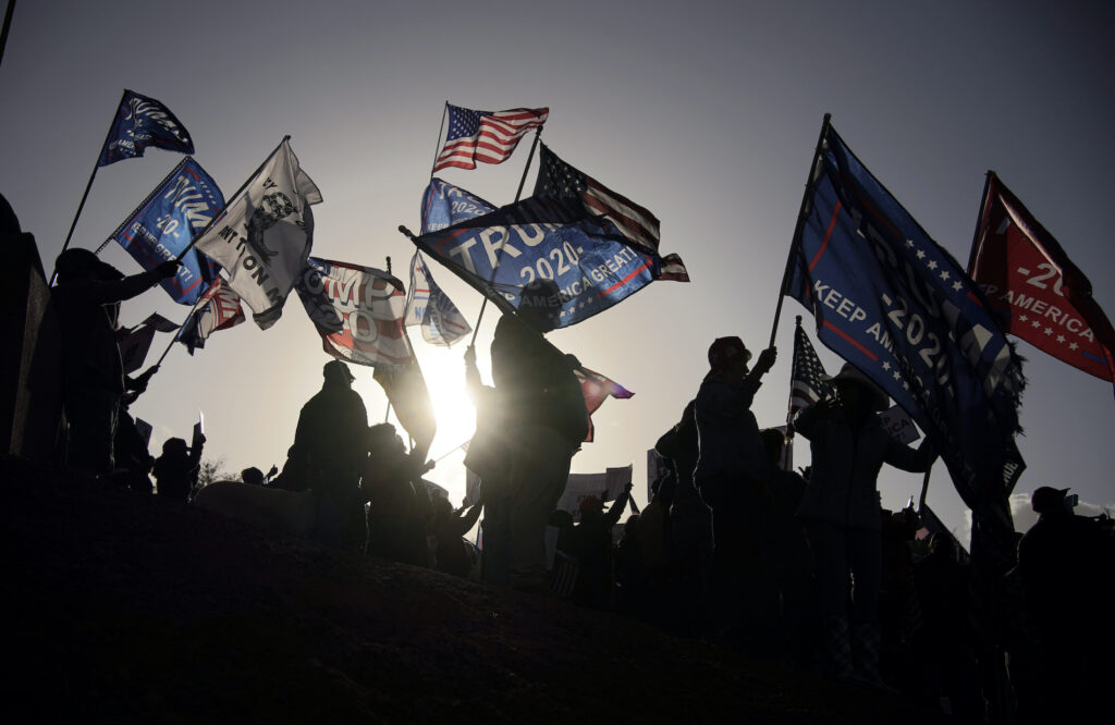 Supporters of President Donald Trump protest the election outside of the Clark County Election Department, Sunday, Nov. 8, 2020, in North Las Vegas. (AP Photo/John Locher)