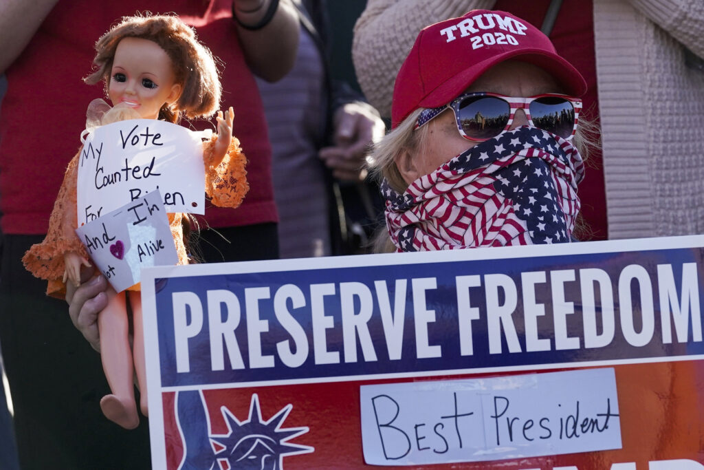 Election 2020 Wisconsin FILE- In a Nov. 7, 2020 file photo, a supporter of President Donald Trump is seen during a rally in Milwaukee after it was announced that the president was defeated by Democrat Joe Biden. President Trump will have to pay $7.9 million if he wants a statewide recount of unofficial results showing him losing to Biden by about 20,500 votes. The Wisconsin Elections Commission released the estimate on Monday, which was based on costs submitted by the 72 counties. (AP Photo/Morry Gash, File)