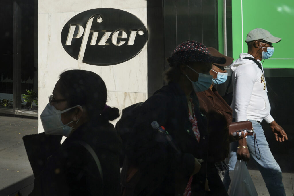 Virus Outbreak Pfizer Vaccine In this Nov. 9, 2020, file photo, pedestrians walk past Pfizer world headquarters in New York.
