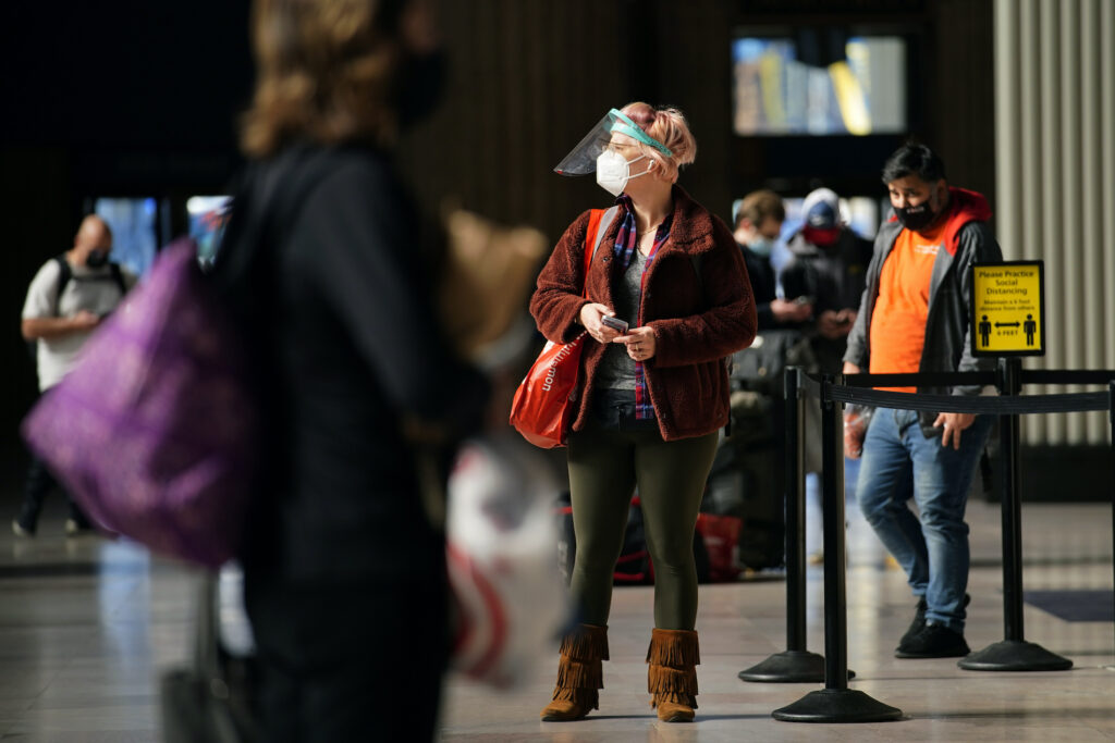A woman makes her way through the 30th Street Station