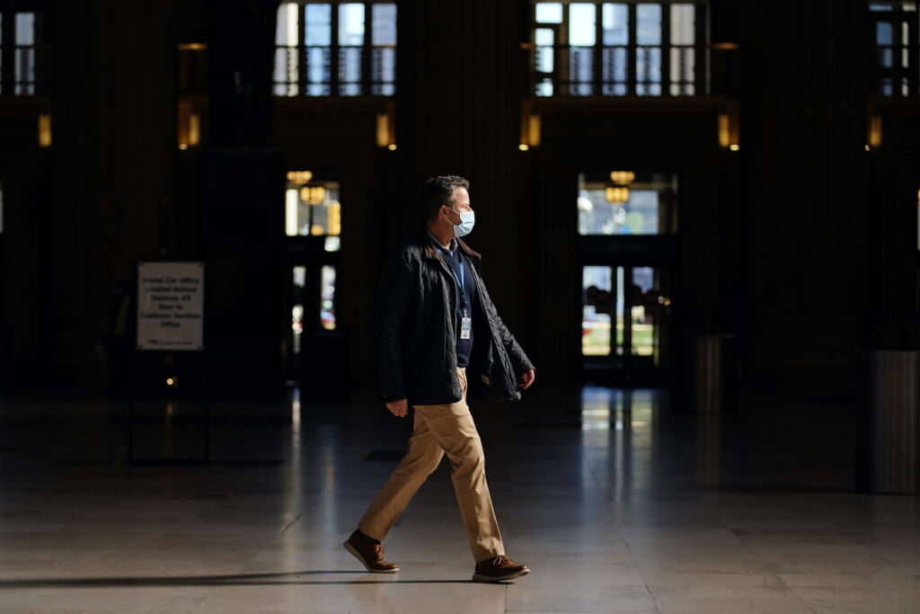 Virus Outbreak Holiday Travel A man walks through the 30th Street Station ahead of the Thanksgiving holiday, Friday, Nov. 20, 2020, in Philadelphia. With the coronavirus surging out of control, the nation's top public health agency pleaded with Americans not to travel for Thanksgiving and not to spend the holiday with people from outside their household. (AP Photo/Matt Slocum)