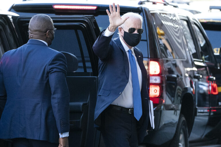 President-elect Joe Biden waves as he arrives The Queen theater for a meeting with Vice President-elect Kamala Harris, Senate Minority Leader Chuck Schumer of N.Y., and House Speaker Nancy Pelosi of Calif., Friday, Nov. 20, 2020, in Wilmington, Del. (AP Photo/Alex Brandon)