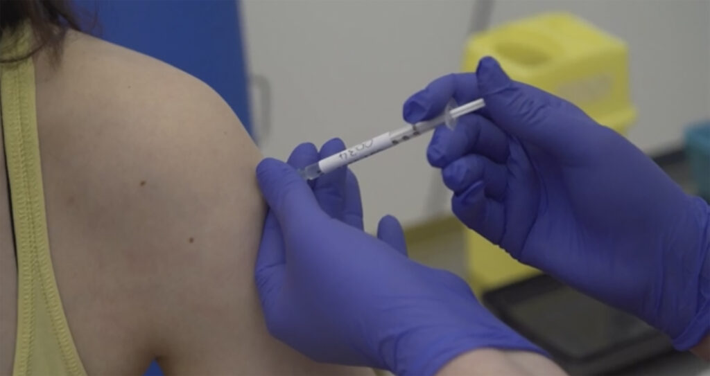 Virus Outbreak Britain Vaccine Test FILE - A person being injected as part of the first human trials in the UK to test a potential coronavirus vaccine, untaken by Oxford University in England.(Oxford University Pool via AP, File)