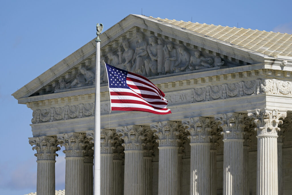 Supreme Court 2020 Census In this Nov. 2, 2020, file photo an American flag waves in front of the Supreme Court building on Capitol Hill in Washington. (AP Photo/Patrick Semansky)