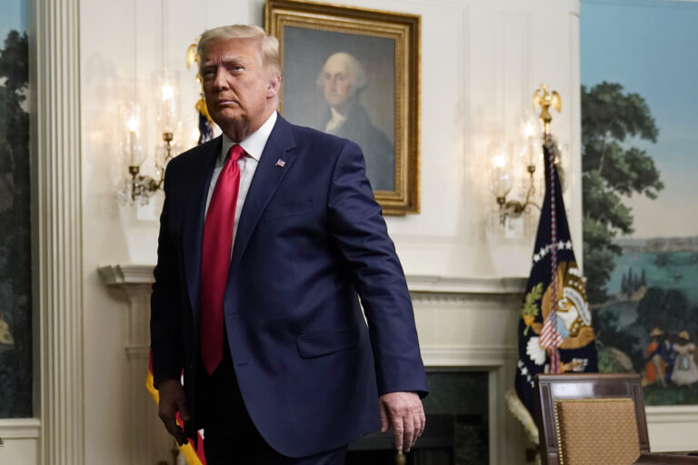 President Trump leaves the Diplomatic Room of the White House.