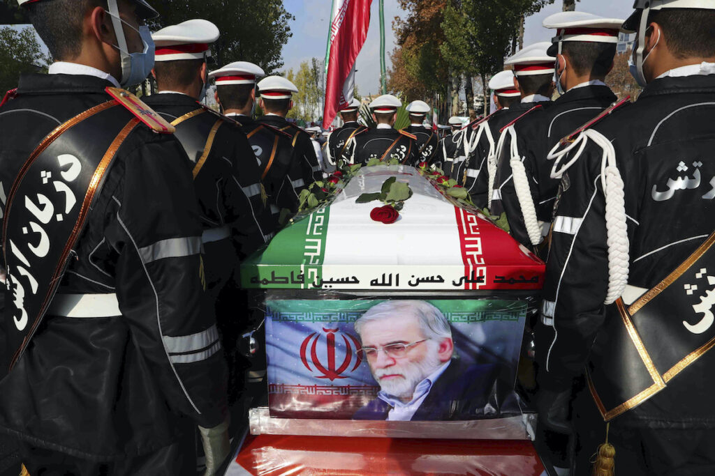 Iran Photo released by the official website of the Iranian Defense Ministry, military personnel stand near the coffin of Mohsen Fakhrizadeh, a nuclear scientist who was killed on Friday, in a funeral ceremony in Tehran, Iran, Monday, Nov. 30, 2020. (Iranian Defense Ministry via AP)