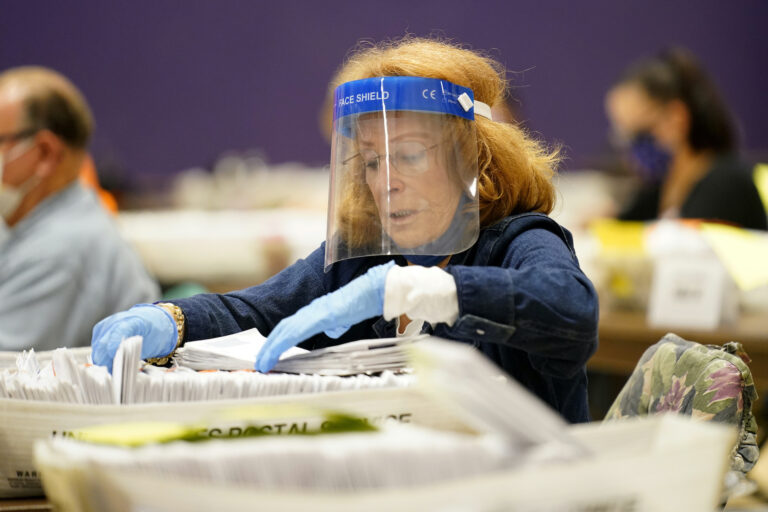 Paula Plotkin processes mail-in ballots at Bergen Community College