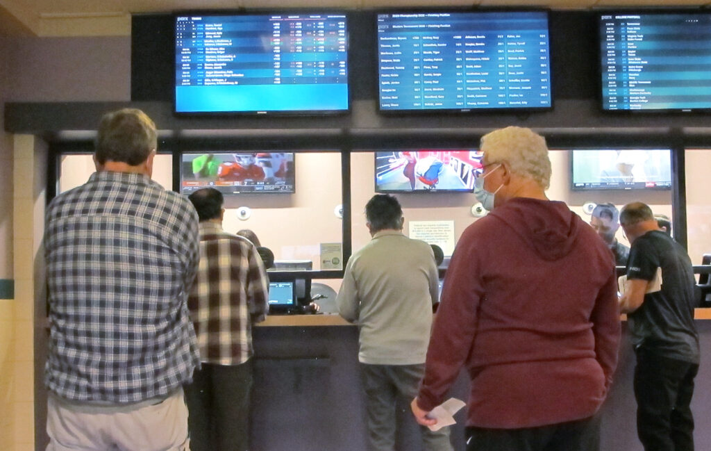 Sports Betting-NJ College Games Customers line up to make sports bets at Freehold Raceway in Freehold