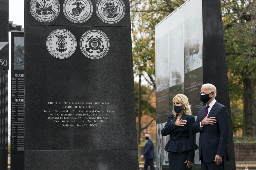 Joe Biden, Jill Biden President-elect Joe Biden, and Jill Biden, stand with their hands over their hearts before placing a wreath at the Philadelphia Korean War Memorial