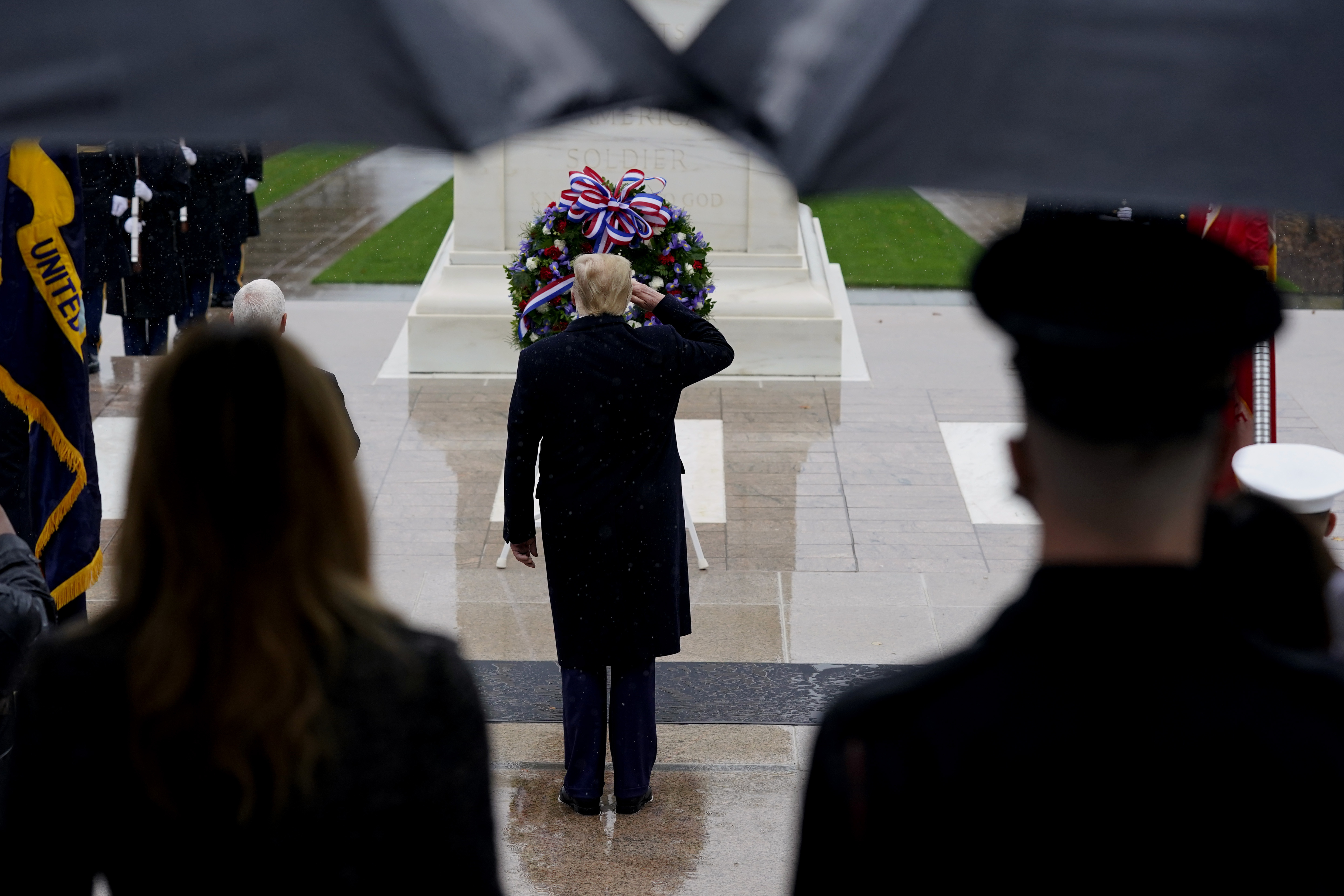 President Donald Trump participates in a wreath laying ceremony on Veterans Day at Arlington National Cemetery