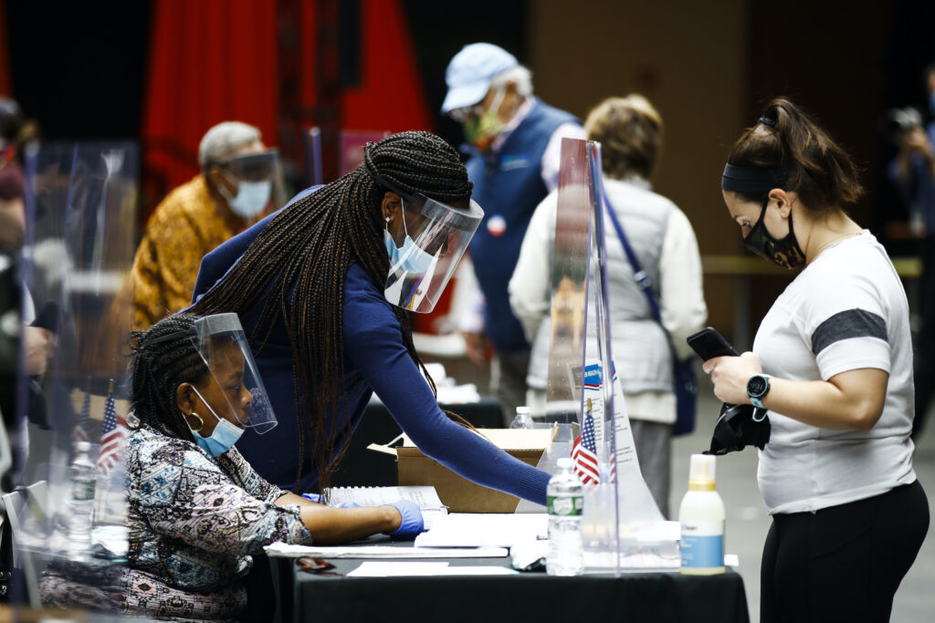 Election 2020 Pennsylvania Primary Election workers, left, check in voters before they cast their ballots in the Pennsylvania primary in Philadelphia
