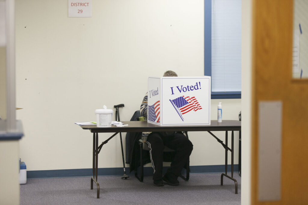 Hounds walk to help save others of their kind A voter fills out their ballot in Cherry Hill, N.J. on Nov. 3, 2020. (Miguel Martinez for WHYY)