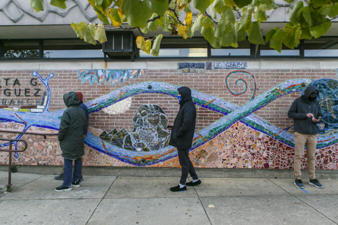 Voters practice social distance while lining up at polling place in Northern Liberties in Philadelphia.