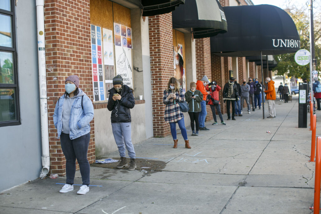 Hounds walk to help save others of their kind Voters practice social distance while lining up at polling place in Northern Liberties in Philadelphia on Election Day. (Miguel Martinez for WHYY)