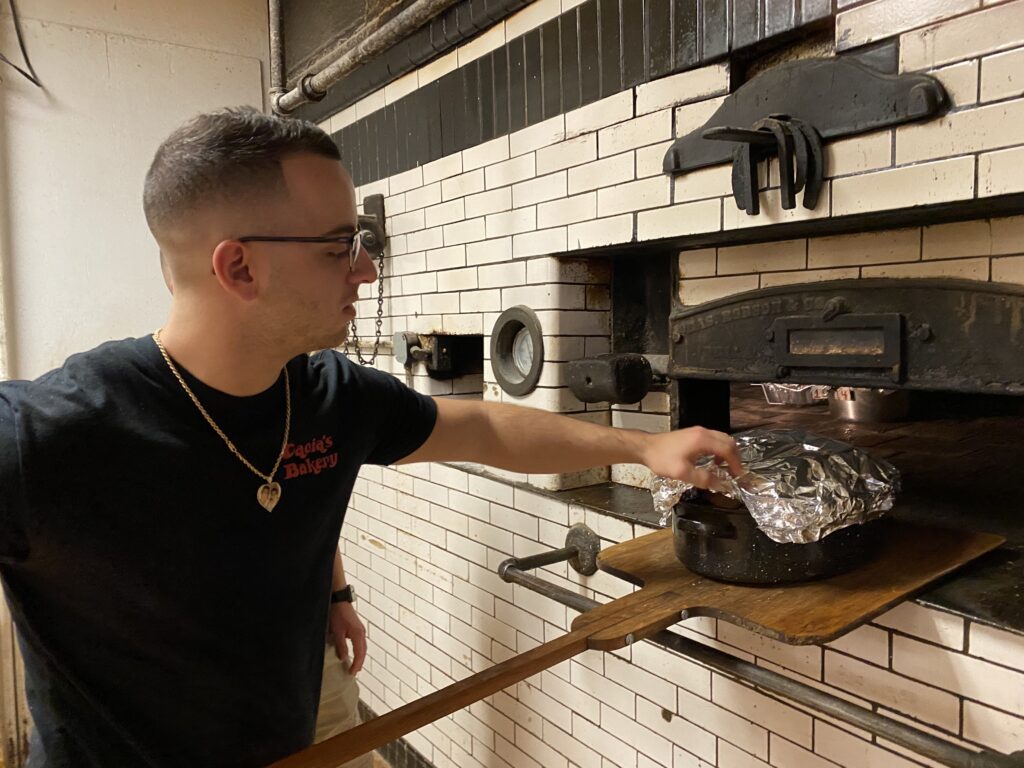 IMG_0703-LT Baker Joe Cacia roasts Thanksgiving turkeys for customers at Cacia's Bakery in South Philly. (Liz Tung / WHYY)