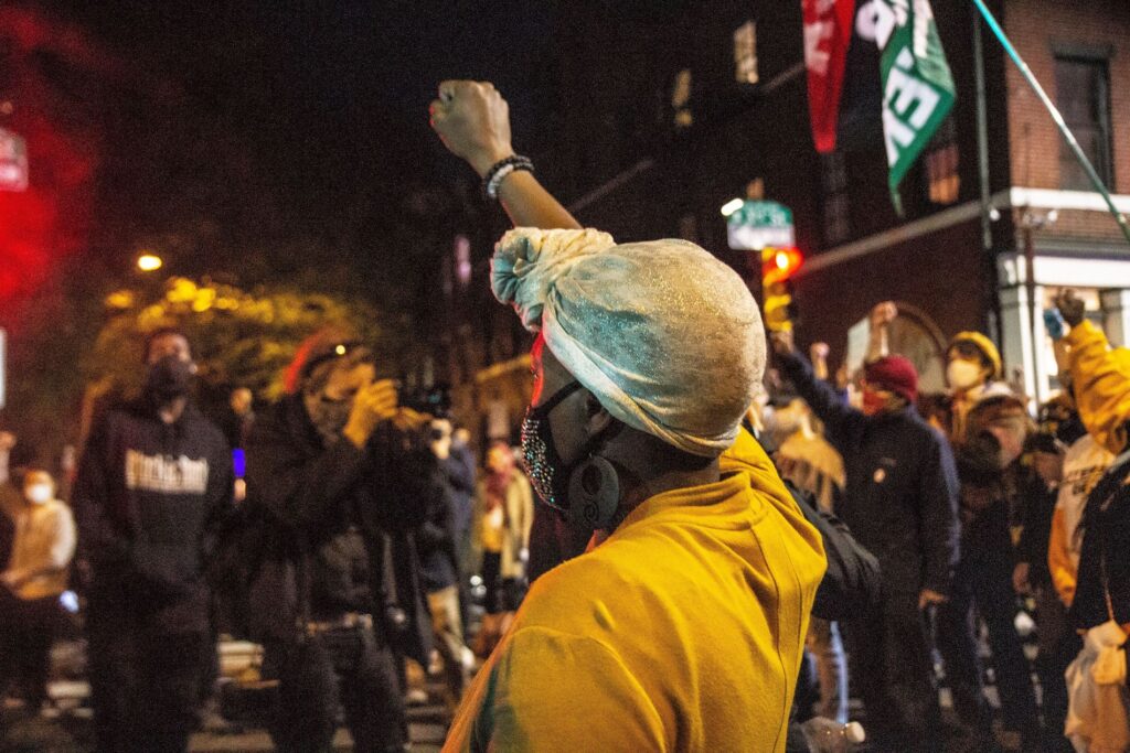 Image from iOS (214) Protesters raised a fist in honor of Walter Wallace Jr. on the eve of the release of officer body cam footage of Wallace’s shooting. (Kimberly Paynter/WHYY)