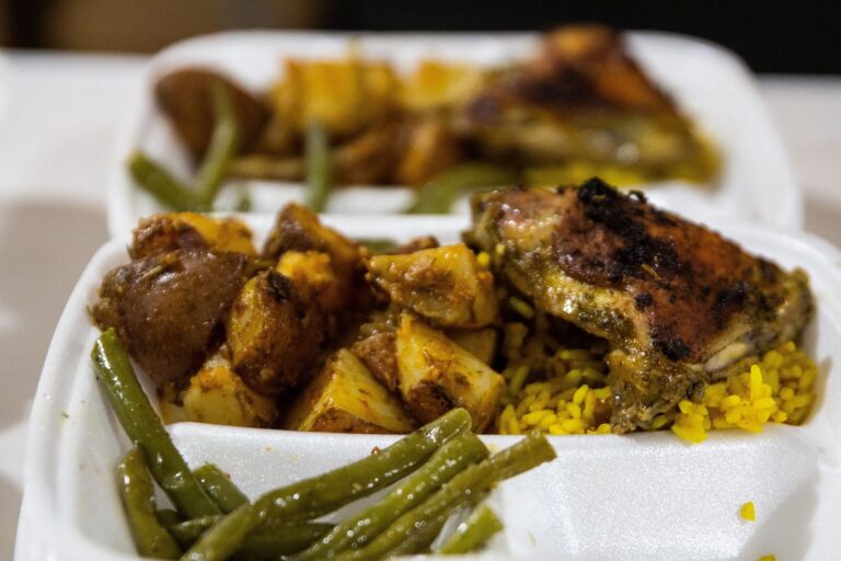 Potatoes, rice, chicken and green beans in to-go containers for those in need at the Chosen 300 Ministries in Philadelphia.