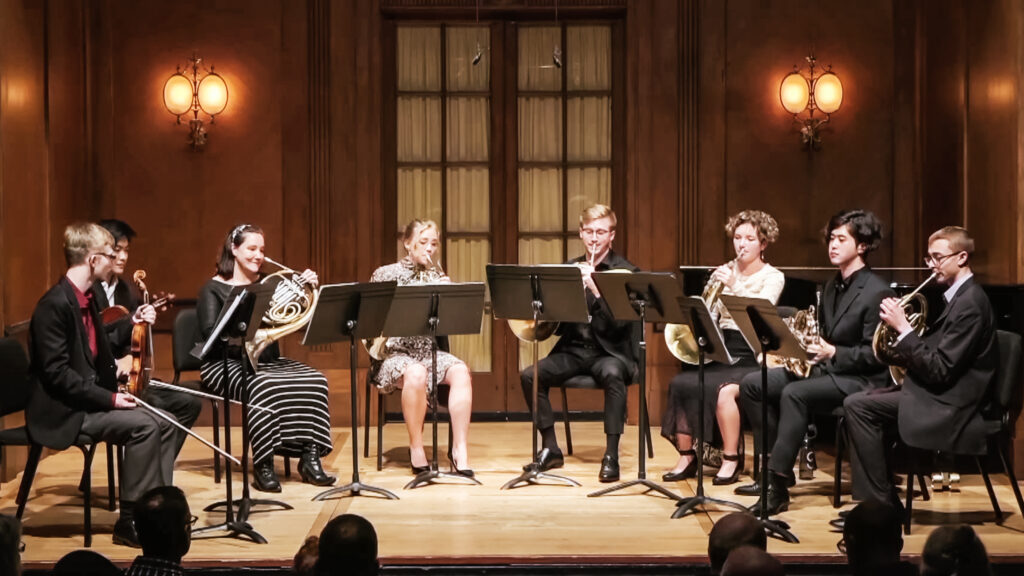 Martina Smith and other Curtis Institute of Music students playing the horn on stage