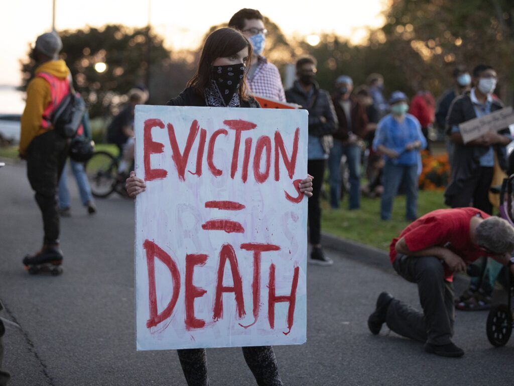 Housing activists gather in Swampscott, Mass., on Oct. 14 to call on the state’s governor to support more robust protections against evictions and foreclosures during the pandemic.