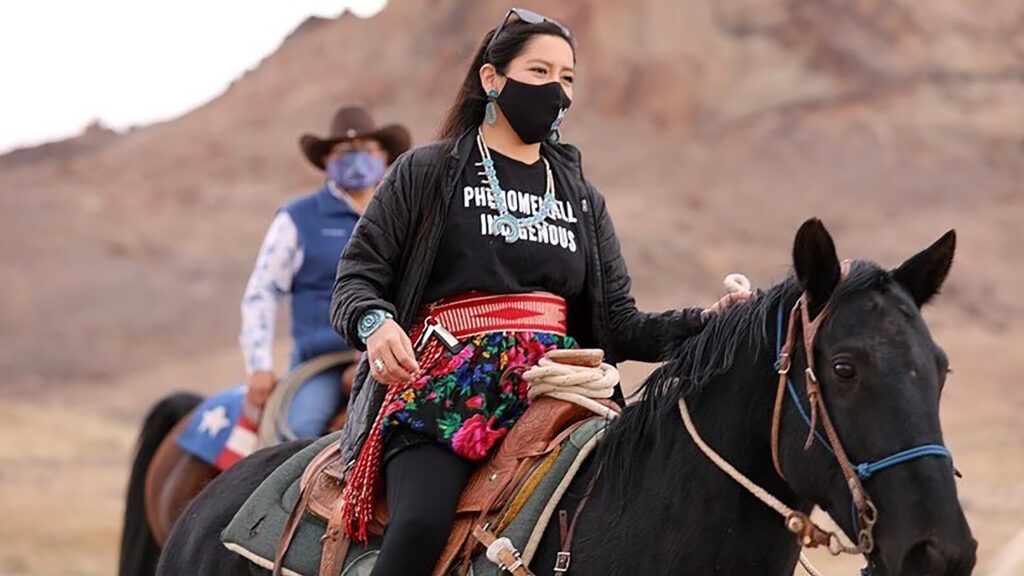 Allie Young, a Diné woman on the Navajo Nation in Arizona, is among a group of Native Americans riding on horseback to the polls on Election Day. (Larry Price/AP)