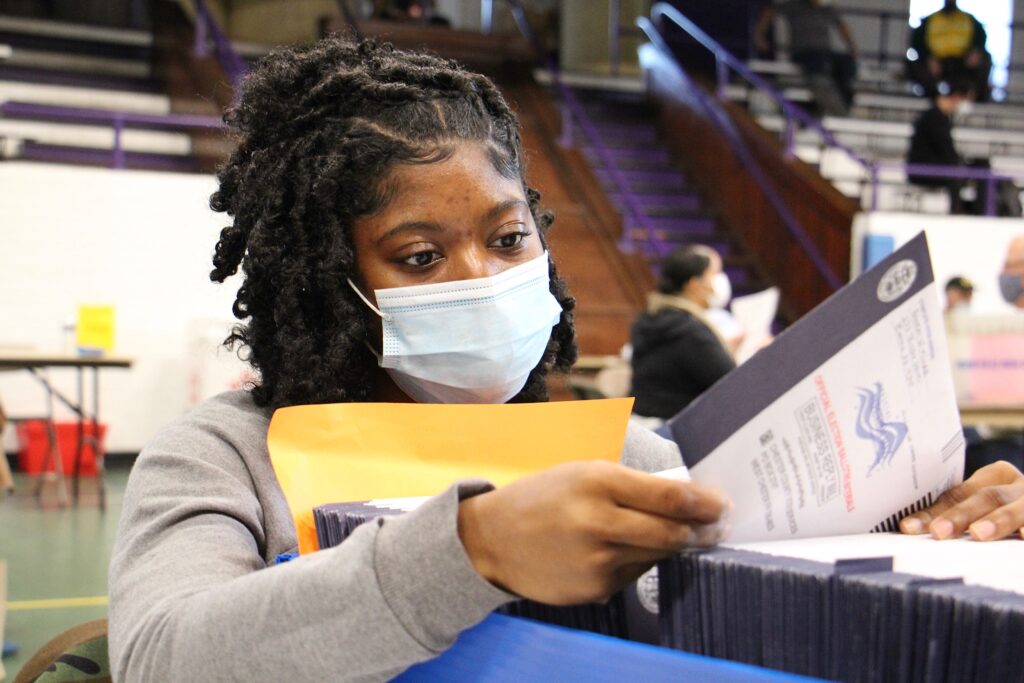 election_day_mail_ballots_EL_110320_03 Chester Country election worker Jessica McPherson inspects ballots