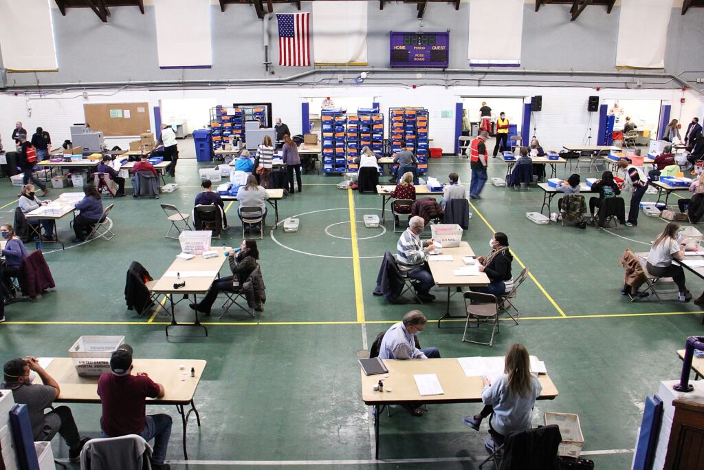 election_day_mail_ballots_EL_110320_07 Chester County election workers sort, inspect, flatten and scan mail in ballots at the West Chester University gym.