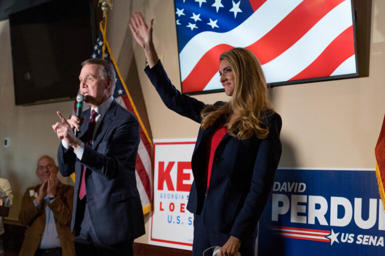 Sens. David Perdue and Kelly Loeffler speak at a campaign event this month at a restaurant in Cumming, Ga. Both are competing in runoff elections in January that will determine which party controls the Senate. (Megan Varner/Getty Images)