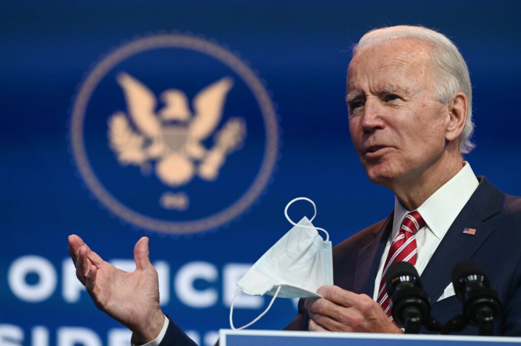 President-elect Joe Biden’s 2020 vote total shatters the 2008 record of 69.5 million votes cast for Barack Obama. President-elect Joe Biden holds a face mask