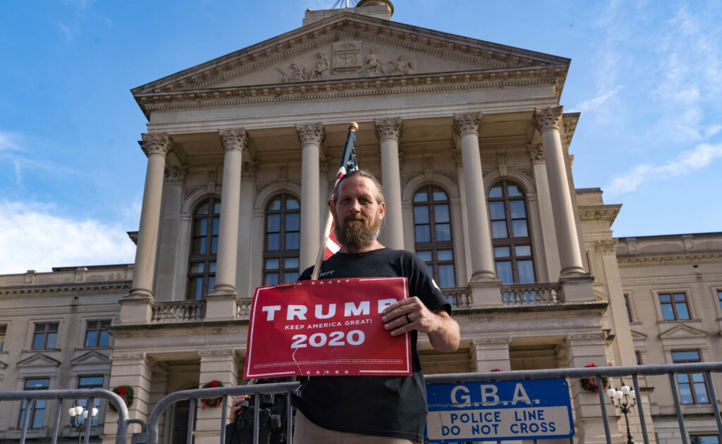 Supporters of Donald Trump host a 'Stop the Steal' protest outside of the Georgia State Capital