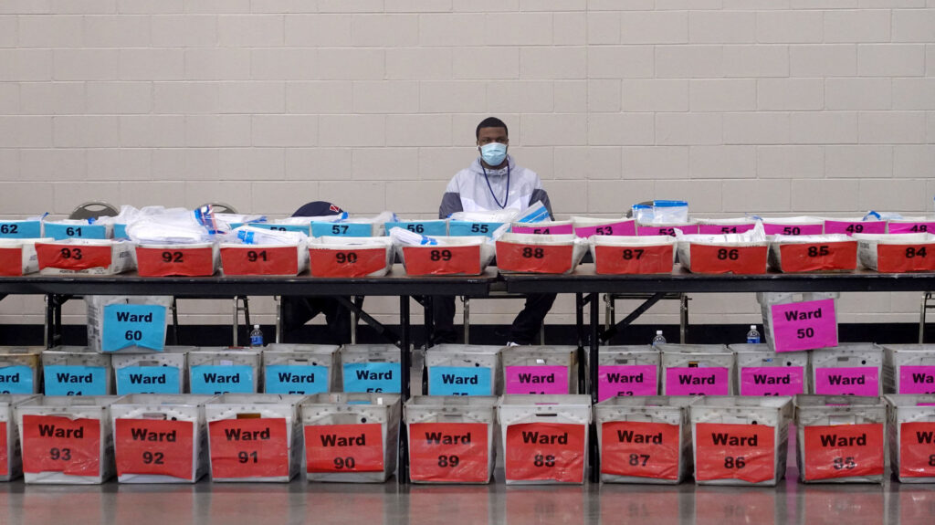 Election Recount Begins In Two Wisconsin Counties An election official pauses during the ballot recount