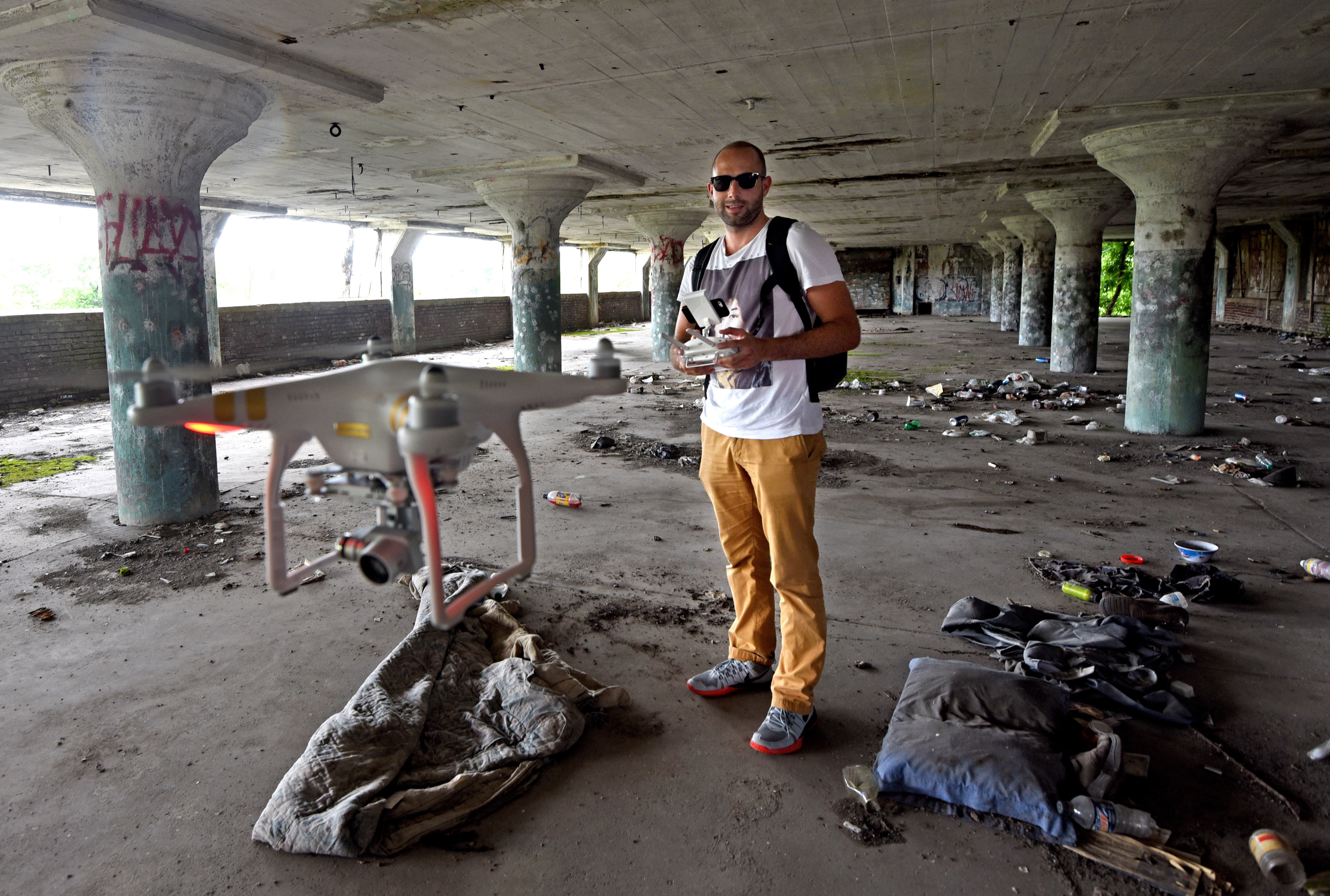 In 2016, Hasan Oswald flies a drone inside an abandoned warehouse in Camden, New Jersey