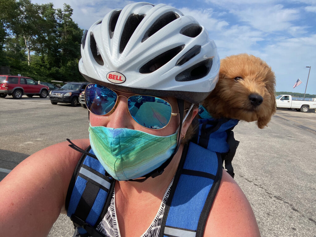 Taco has kept Devin Green busy and her anxiety at bay. “I’m consumed with him more than the worries in my mind.” Devin Green rides a bike with her pup Taco