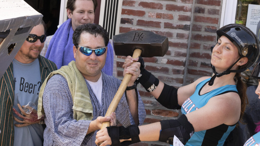 pbw2015-scoats-graylodge-beer-hammerofglory Mike 'Scoats' Scotese (Left) holds the Philly Beer Week Hammer of Glory outside Grey Lodge Pub in 2015. (Danya Henninger/Billy Penn)