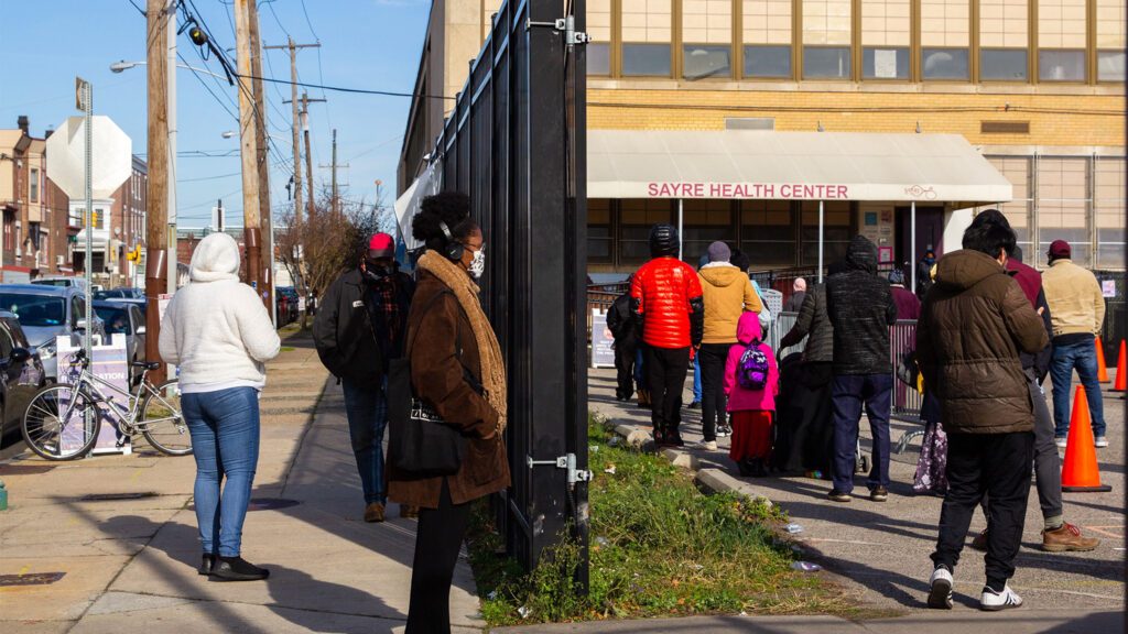 testsite-sayrehealthcenter-2020nov-01crop People stand in line outside Sayre Health Center for COVID testing a week before Thanksgiving in West Philadelphia. (Kimberly Paynter/WHYY)